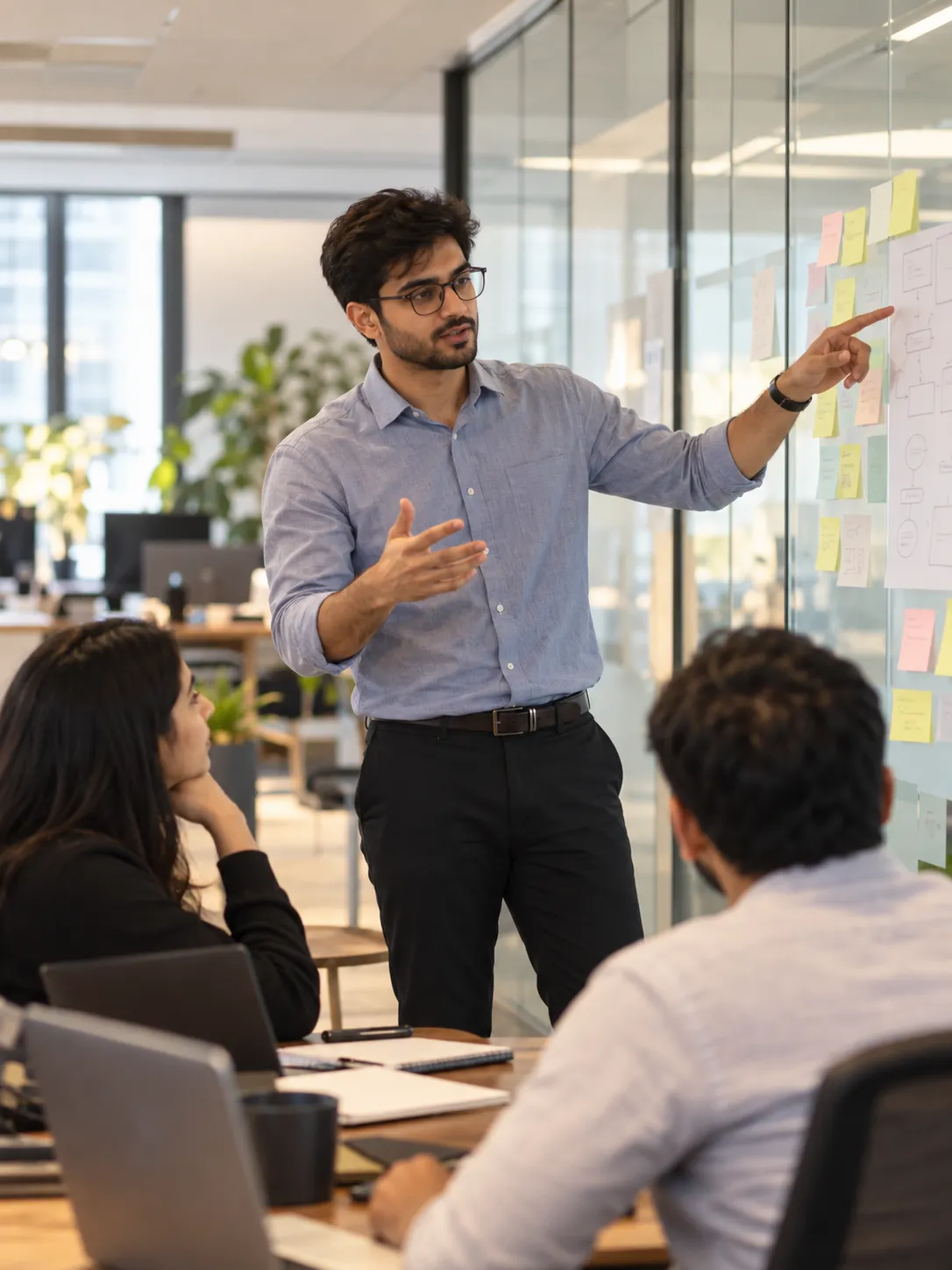Consultant presenting a delivery plan to a client team